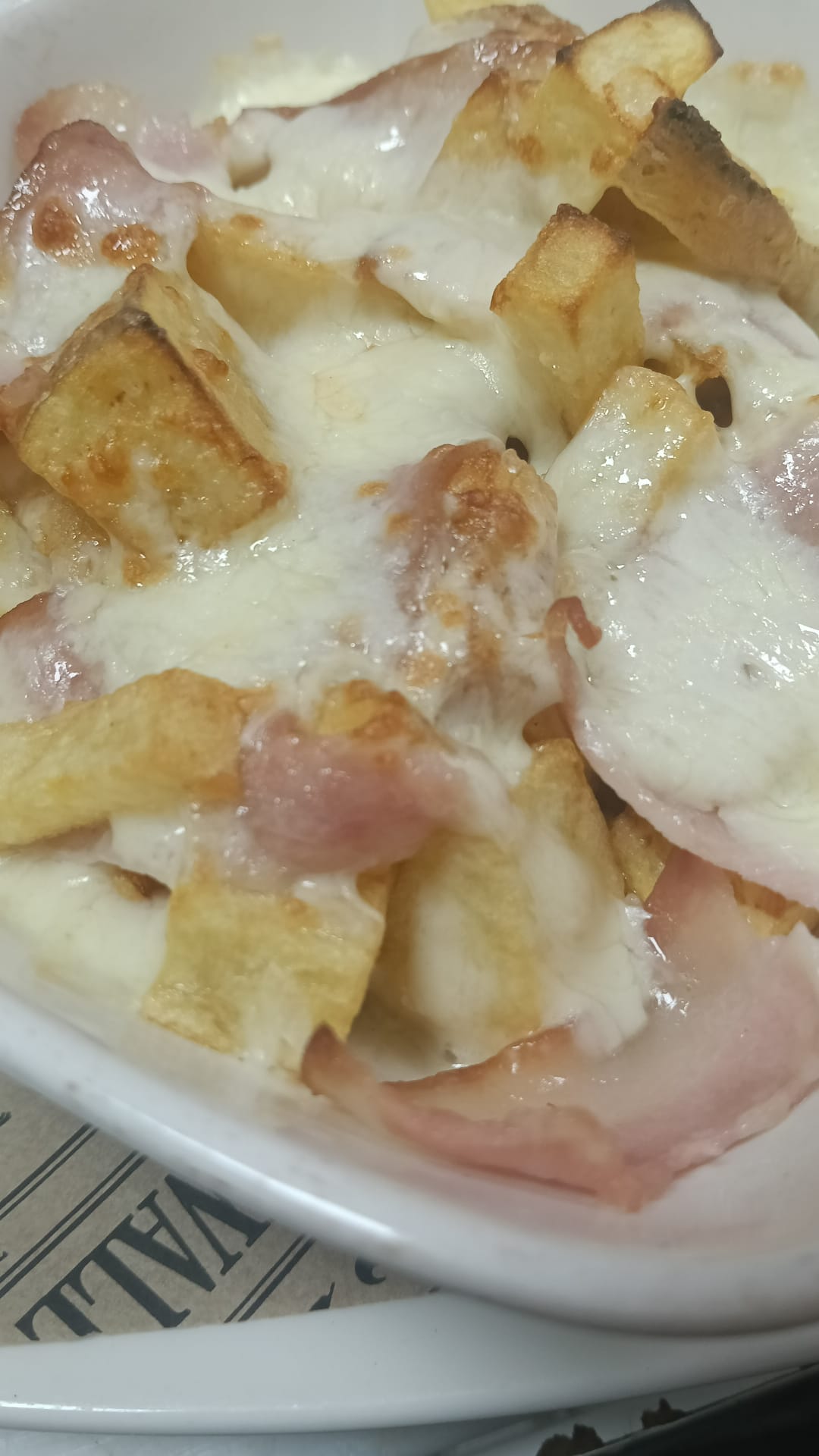 Papas queso con bacon o pollo